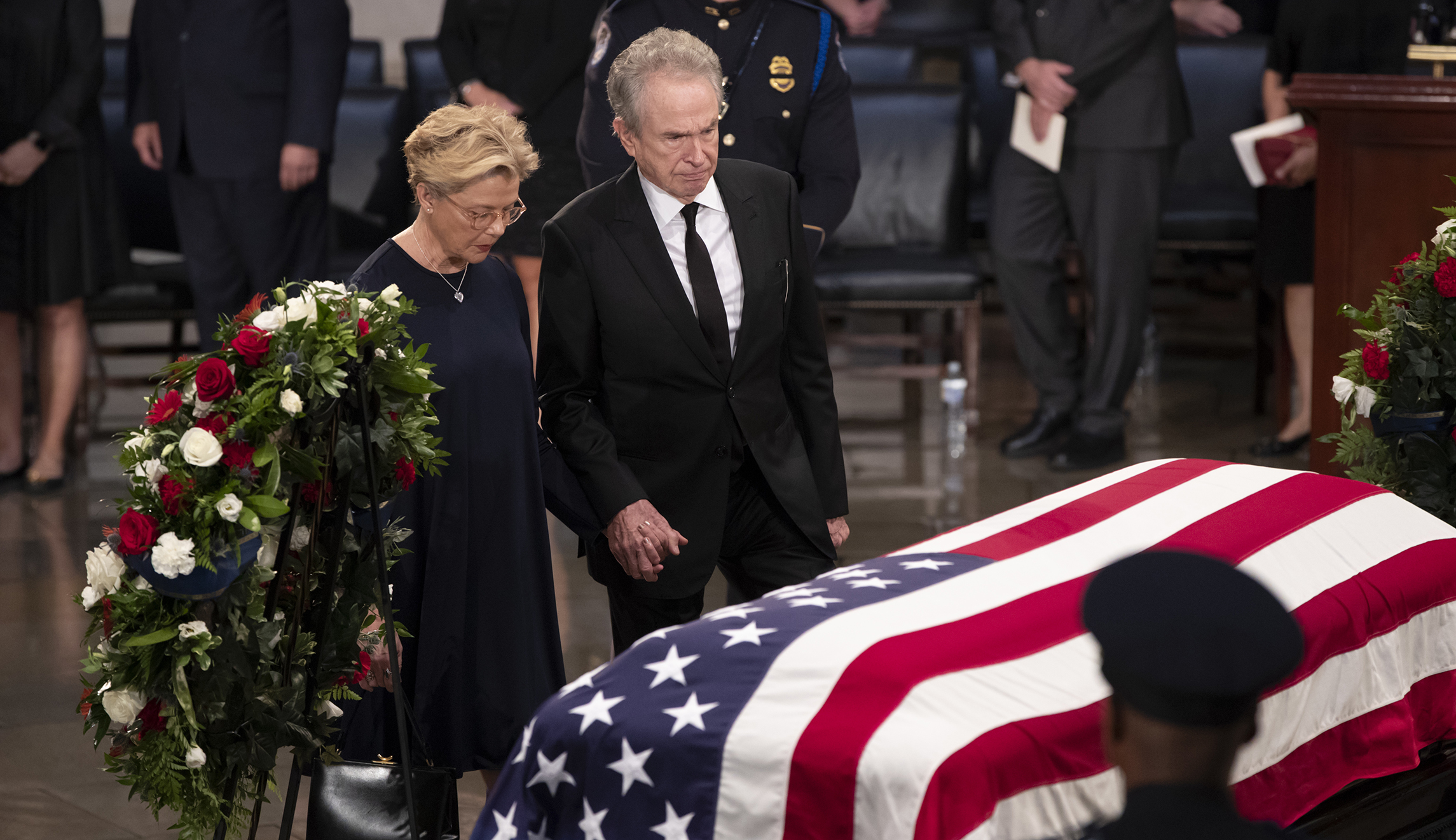 Actors Warren Beatty, right, and his wife Annette Bening, pay their respects at the flag-draped casket of Sen. John McCain of Arizona, who lived and worked in Congress over four decades, in the U.S. Capitol rotunda, Friday, Aug. 31, 2018, in Washington. McCain was a six-term senator, a former Republican nominee for president, and a Navy pilot who served in Vietnam, where he endured five-and-a-half years as a prisoner of war. He died Aug. 25 from brain cancer at age 81. 