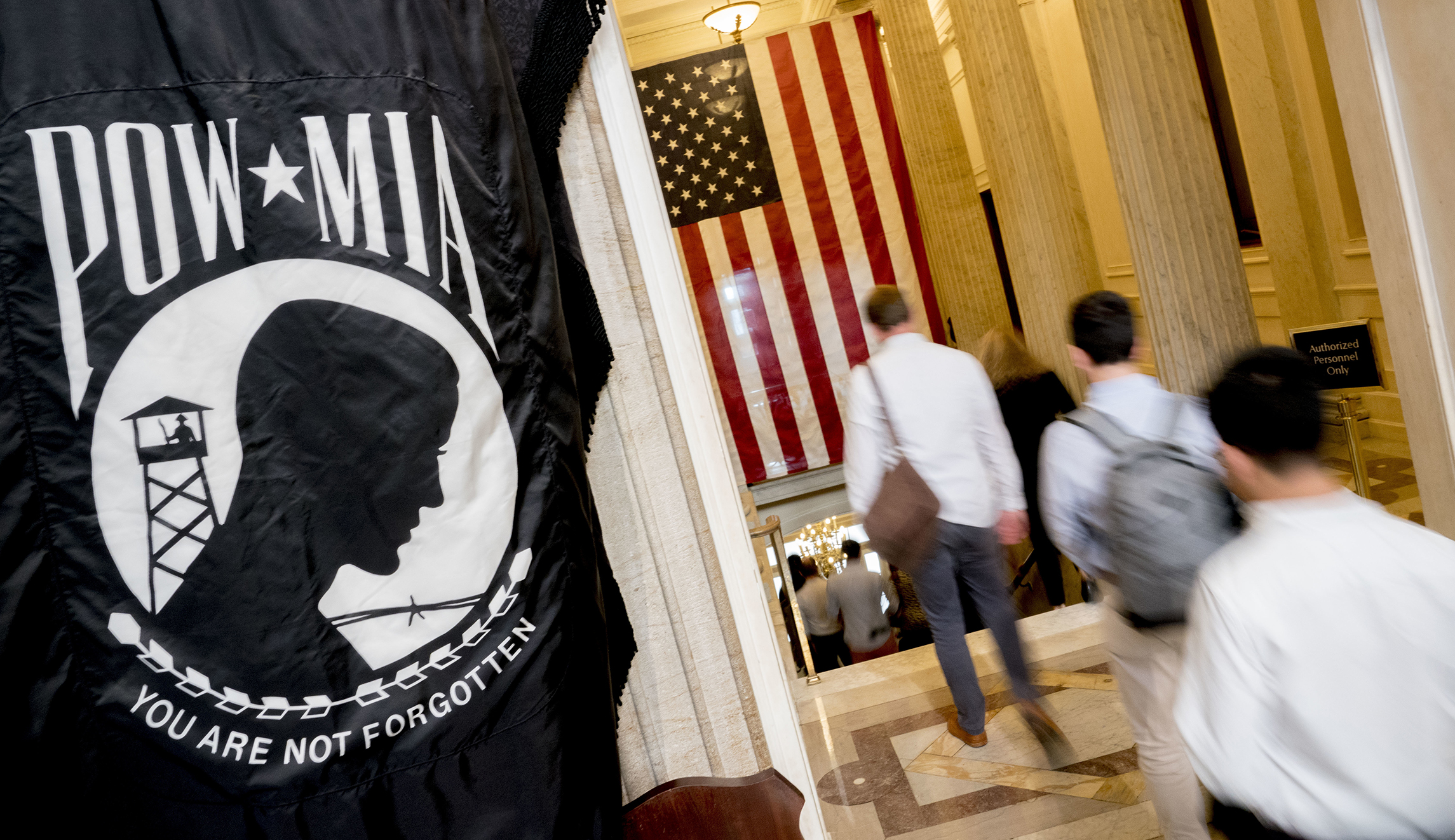 Visitors leave the Rotunda after paying respects to Sen. John McCain, R-Ariz., as he lies in state in the U.S. Capitol, Friday, Aug. 31, 2018, in Washington. 
