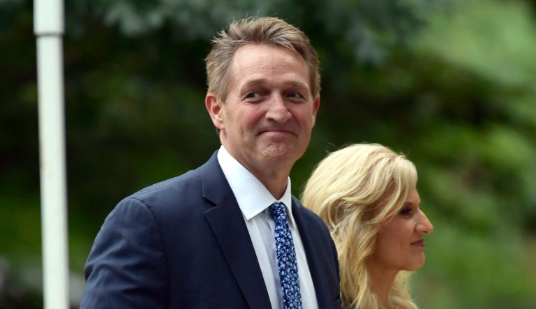 Sen. Jeff Flake, R-Ariz., (pictured left) and his wife Cheryl Flake arrive to attend a memorial service for Sen. John McCain, R-Ariz., at the Washington National Cathedral in D.C. on Saturday.