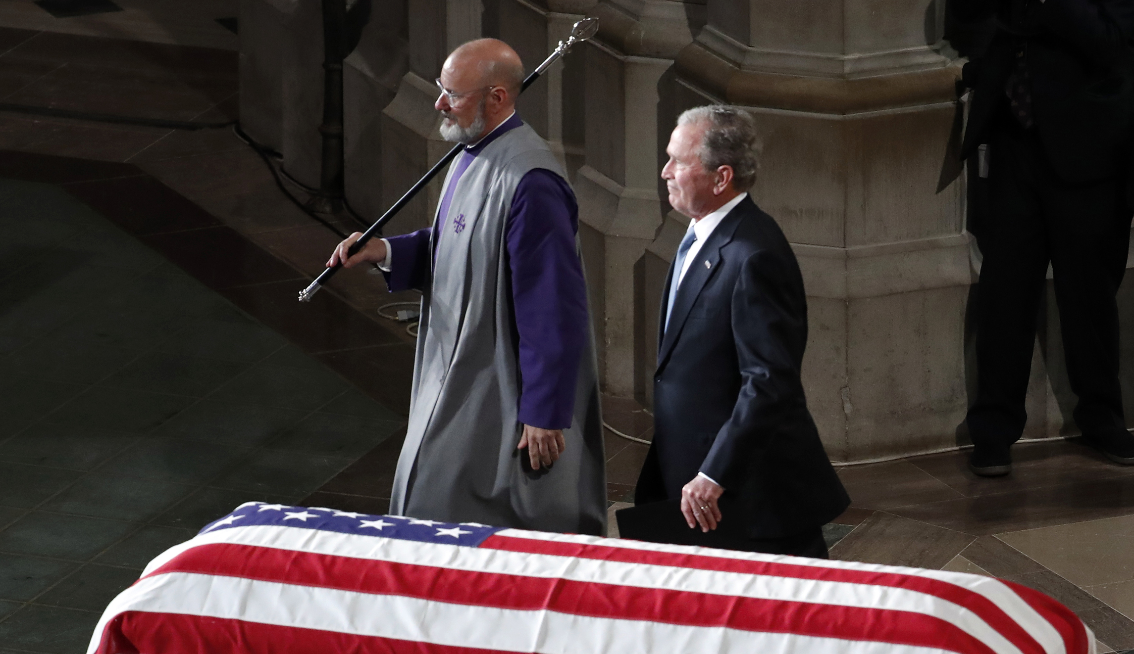 Former President George W. Bush walks away after speaking at a memorial service for Sen. John McCain, R-Ariz., at Washington National Cathedral in Washington, Saturday, Sept. 1, 2018.