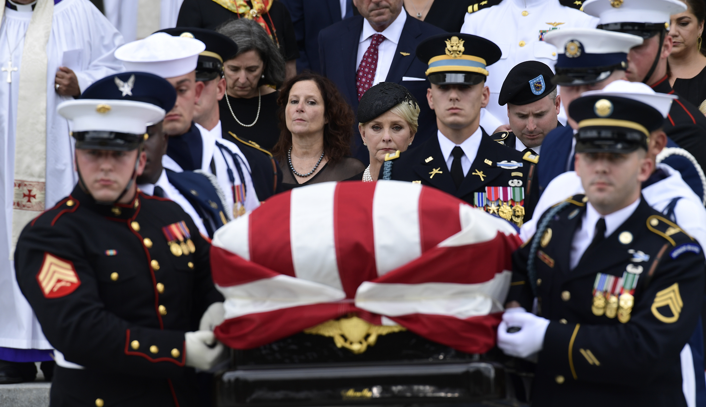 Trump casts long shadow over McCain funeral