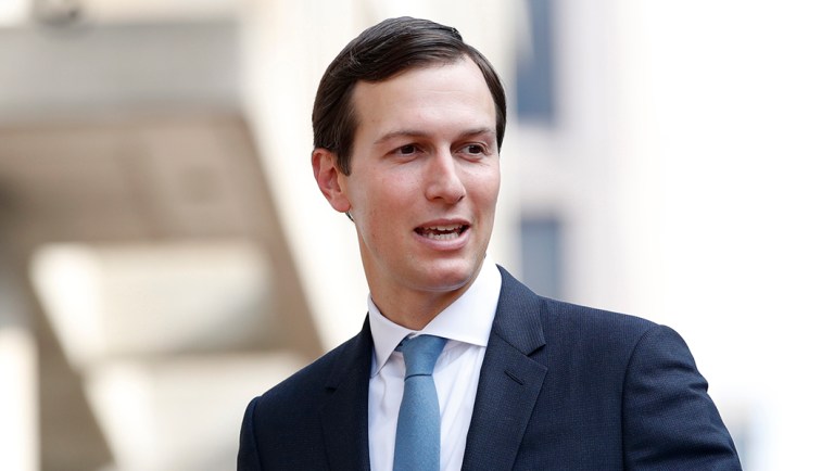 White House adviser Jared Kushner waves as he arrives at the Office of the United States Trade Representative.