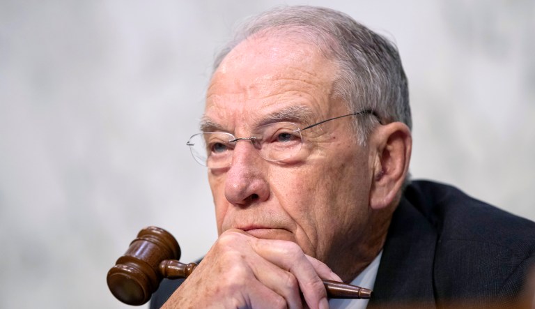 Senate Judiciary Committee Chairman Chuck Grassley, R-Iowa, wields his gavel as President Trump's Supreme Court nominee, Brett Kavanaugh, appears during a confirmation hearing.