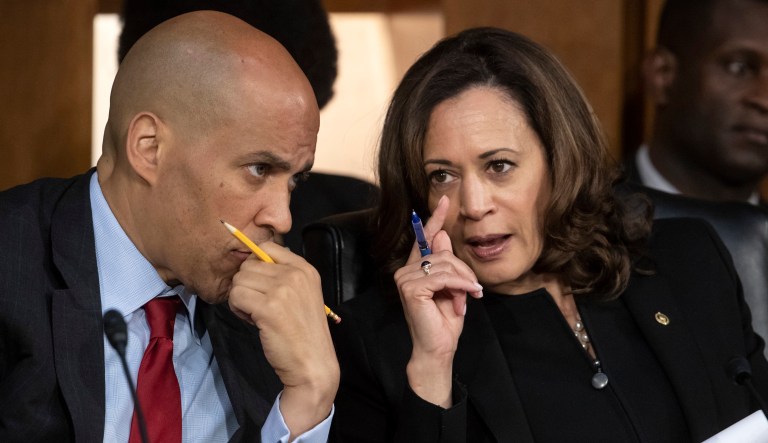 Sen. Cory Booker, D-N.J., and Sen. Kamala Harris, D-Calif., confer as Supreme Court nominee Brett Kavanaugh testifies before the Senate Judiciary Committee on the third day of his confirmation hearing on Capitol Hill, Sept. 6, 2018.
