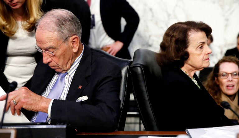 Senate Judiciary Committee Chairman Chuck Grassley, R-Iowa, (left) and Sen. Dianne Feinstein, D-Calif., (right) the ranking member on the Senate Judiciary Committee, work with their aides during a break in Brett Kavanaugh's testimony before the Senate Judiciary Committee on Capitol Hill in Washington, D.C.