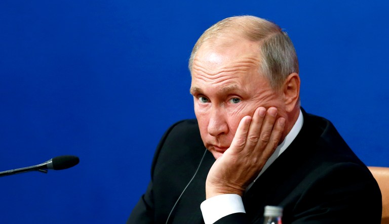 Russia's President Vladimir Putin attends a press conference.
