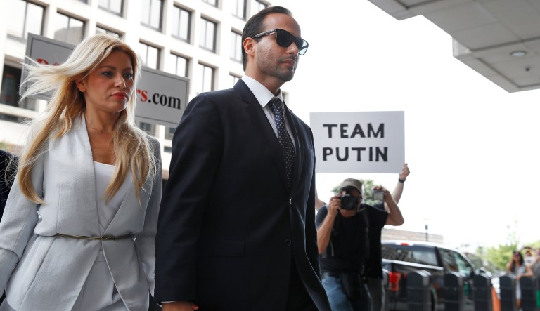 Former Donald Trump presidential campaign foreign policy adviser George Papadopoulos, who triggered the Russia investigation, and who pleaded guilty to one count of making false statements to the FBI, holds hands with his wife Simona Mangiante as they arrive at federal court for sentencing, Friday, Sept. 7, 2018, in Washington.