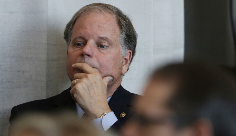 Sen. Doug Jones, D-Ala., waits to speak at the dedication for the United States Courthouse for the Southern District of Alabama in Mobile, Ala., on Friday, Sept. 7, 2018.
