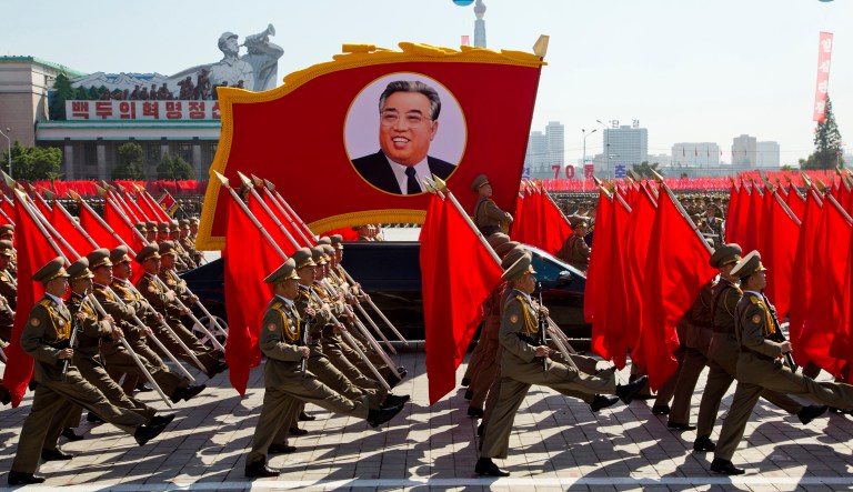North Korean soldiers march with a float showing late North Korean leader Kim Il Sung during a parade for the 70th anniversary of North Korea's founding day in Pyongyang, North Korea, Sunday, Sept. 9, 2018. North Korea staged a major military parade, huge rallies and will revive its iconic mass games on Sunday to mark its 70th anniversary as a nation.