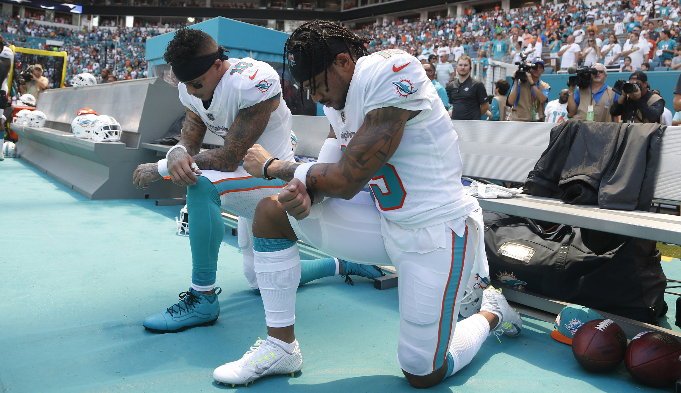 Miami Dolphins players kneel during national anthem, bringing controversial protests to 2018 NFL season