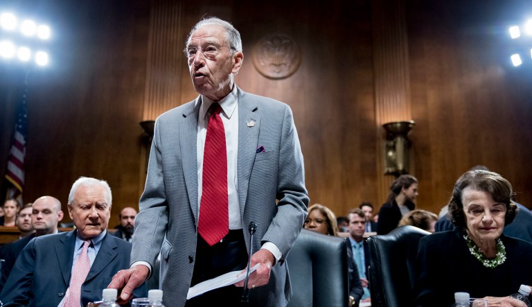 Senate Judiciary Committee Chairman Chuck Grassley, R-Iowa, center, accompanied by Sen. Dianne Feinstein, D-Calif., the ranking member, right, and Sen. Orrin Hatch, R-Utah, gavels the start of a Senate Judiciary Committee meeting in Washington, D.C.