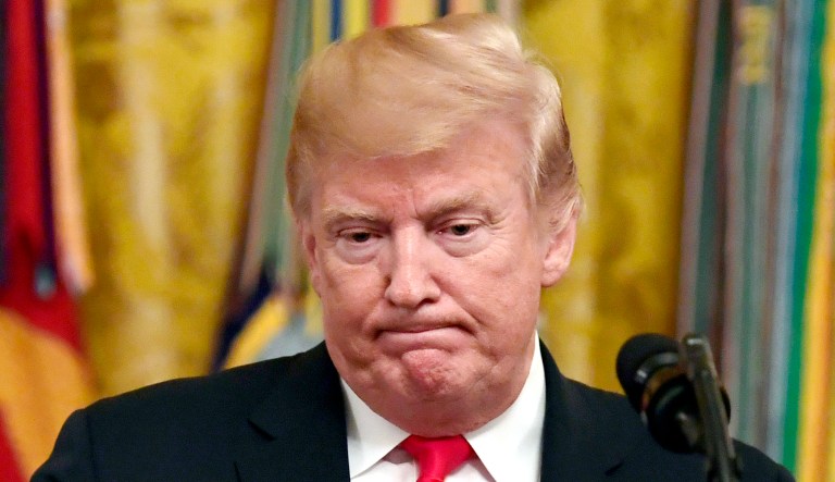 President Trump speaks during a reception in the East Room of the White House in D.C.