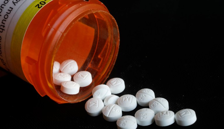 This Aug. 29, 2018 photo shows an arrangement of prescription Oxycodone pills in New York. Figures from a 2017 survey released on Friday, Sept. 14, 2018, show fewer people used heroin for the first time compared to the previous year, and fewer Americans misusing or addicted to prescription opioid painkillers.