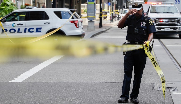 FILE - In this Sept. 6, 2018, file photo, emergency personnel and police respond to reports of an active shooter situation near Fountain Square in downtown Cincinnati. Suspect Omar Enrique Santa Perez was killed by police officers.