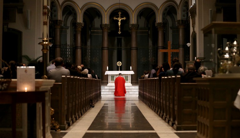 Bishop Barry C. Knestout kneels during the Mass of Atonement at Cathedral of the Sacred Heart, Friday Sept. 14, 2018 in Richmond, Va.. A Catholic bishop in Virginia is celebrating a "Mass of Atonement" in light of a Pennsylvania grand jury's allegations that some 300 priests abused more than 1,000 children over 70 years and bishops covered up for them.
