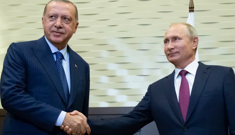 Russian President Vladimir Putin, right, and Turkish President Recep Tayyip Erdogan shake hands during their meeting in the Bocharov Ruchei residence in the Black Sea resort of Sochi in Sochi, Russia, Monday, Sept. 17, 2018. The presidents of Russia and Turkey are meeting in the Russian Black Sea resort of Sochi on Monday in a bid to find a diplomatic resolution to the crisis around a rebel-held region in Syria.