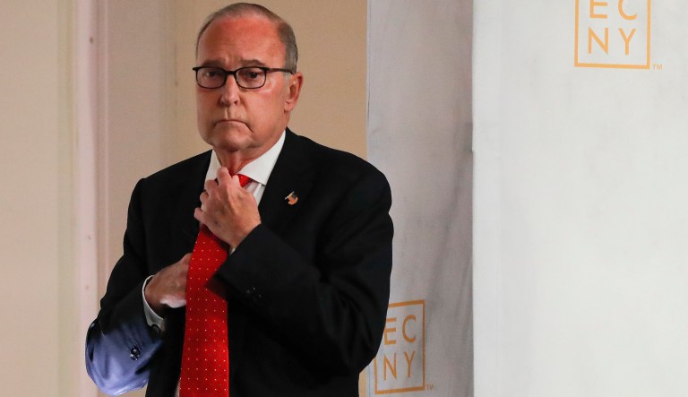 Larry Kudlow, director of the National Economic Council, adjusts his tie before speaking during a meeting at the Economic Club of New York, Monday, Sept. 17, 2018, in New York.