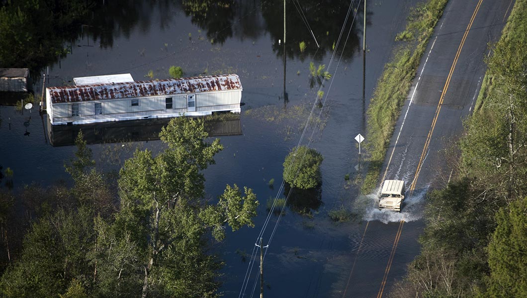 A truck drives through floodwaters after Hurricane Florence struck the Carolinas.
