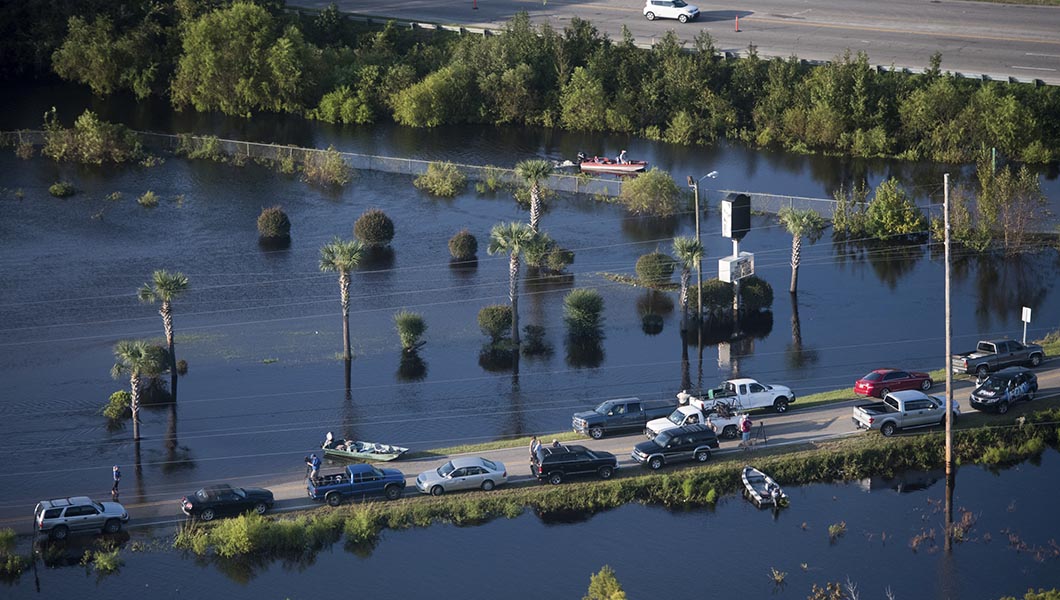 People use a road as a boat ramp after Hurricane Florence struck the Carolinas.