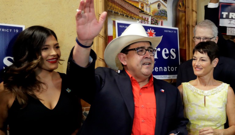 CORRECTS DATE Republican Pete Flores, center, stands with his daughter Vicky, left, and state Sen. Donna Campbell, right, as he talks to supports after he defeated Democrat Pete Gallego in a runoff election capturing a reliably blue state Senate seat, Tuesday, Sept. 18, 2018, in San Antonio. Flores will replace Sen. Carlos Uresti, who stepped down in June after being sentenced to 12 years in prison on federal fraud charges.