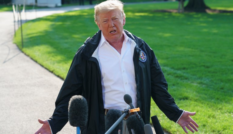 President Donald Trump gestures as he talks to media before boarding Marine One on the South Lawn of the White House in Washington, Wednesday, Sept. 19, 2018, for the short trip to Andrews Air Force Base en route to Havelock, N.C.
