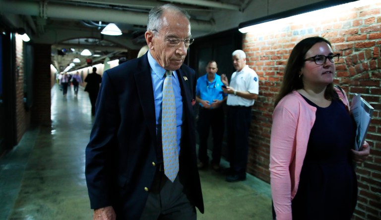 Senate Judiciary Committee Chairman Sen. Chuck Grassley, R-Iowa, walks through a tunnel towards the Dirksen Senate Building on Capitol Hill in Washington, Wednesday, Sept. 19, 2018.