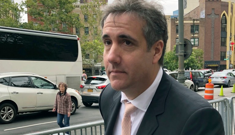 Michael Cohen, President Trump's former lawyer, waits for his ride after making an unannounced visit to the federal courthouse in New York, Friday, Sept. 21, 2018. Cohen left the building, declining to say why he was there as well as refusing to talk about any discussions he's had with special counsel Robert Mueller.