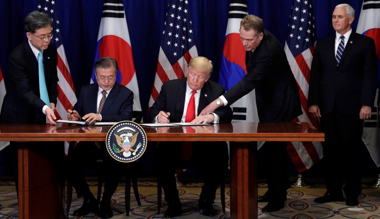 President Trump and South Korean President Moon Jae-In participate in a signing ceremony for the United States-Korea Free Trade Agreement in New York. At right is Vice President Mike Pence and United States Trade Representative Robert Lighthizer, second from right. 