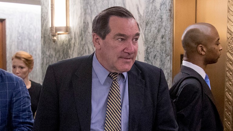 Sen. Joe Donnelly, D-Ind., center, arrives on Capitol Hill.
