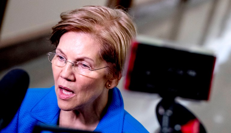 Sen. Elizabeth Warren, D-Mass., speaks to reporters as she arrives for a hearing on Capitol Hill in D.C.