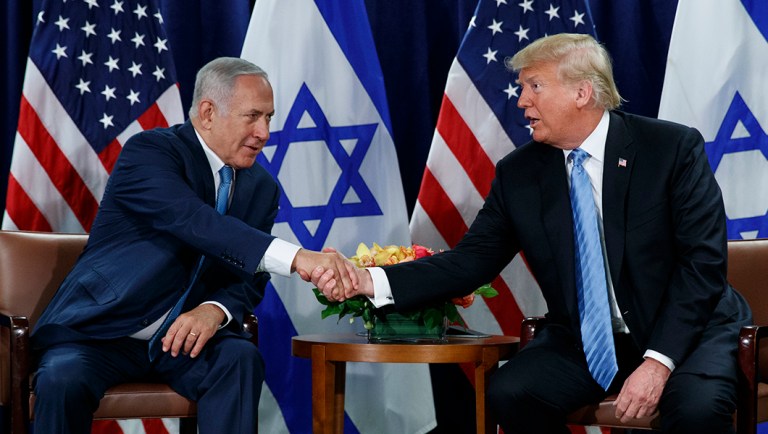 President Trump shakes hands with Israeli Prime Minister Benjamin Netanyahu.