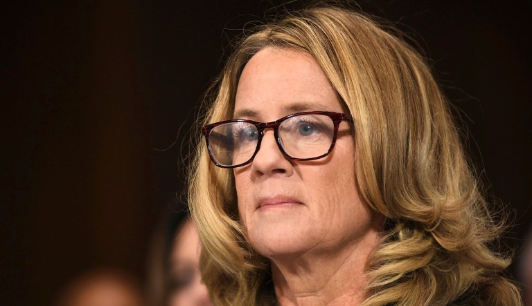 Christine Blasey Ford listens to opening statements before testifying to the Senate Judiciary Committee on Capitol Hill in Washington, D.C.