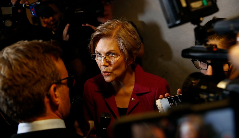 Sen. Elizabeth Warren, D-Mass., speaks with reporters inside the Hart Senate Office Building on Capitol Hill in Washington, Thursday, Sept. 27, 2018.
