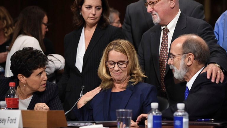 Christine Blasey Ford takes a break in her testimony before the Senate Judiciary Committee.