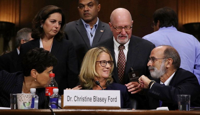 Christine Blasey Ford and her attorney's Debra Katz, left, and Michael Bromwich, right, take a break during testimony before the Senate Judiciary Committee, Thursday, Sept. 27, 2018 in Washington.