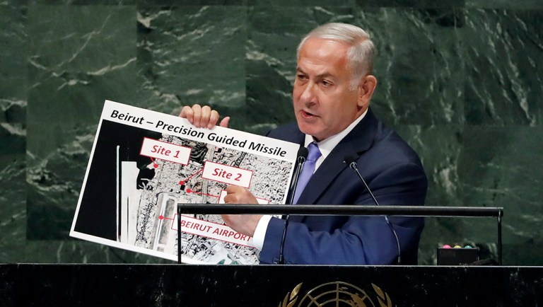 Israel's Prime Minister Benjamin Netanyahu shows guided missile sites in Beirut during his address of the 73rd session of the United Nations General Assembly.
