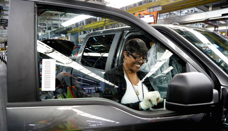 Mel Miller works on the quality control area of the 2018 Ford F-150 truck being assembled at the Ford Rouge assembly plant in Dearborn, Mich. 