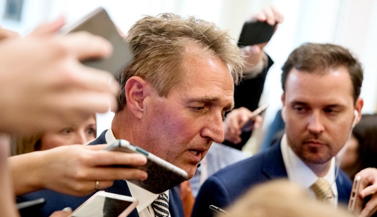 Sen. Jeff Flake, R-Ariz., speaks with reporters after meeting with Senate Majority Leader Mitch McConnell, R-Ky. in the Capitol.
