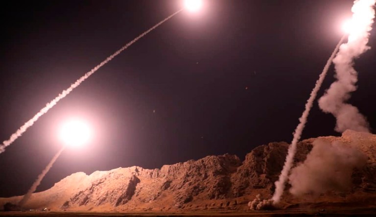 In this photo released on Monday, Oct. 1, 2018, by the Iranian Revolutionary Guard, missiles are fired from city of Kermanshah in western Iran targeting the Islamic State group in Syria. Iran's paramilitary Revolutionary Guard said Monday it launched ballistic missiles into eastern Syria targeting militants it blamed for a recent attack on a military parade.