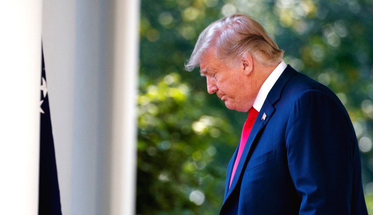President Trump arrives for a news conference on trade in the Rose Garden of the White House in Washington.