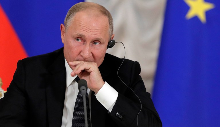 Russian President Vladimir Putin attends a news conference with Austria's Federal Chancellor Sebastian Kurz after their meeting in the State Hermitage museum in St.Petersburg, Russia, Wednesday, Oct. 3, 2018.