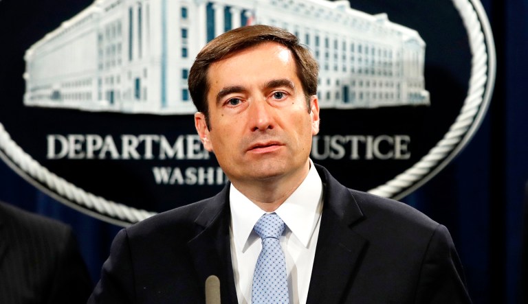 Assistant Attorney General for National Security John Demers answers questions during a news conference at the Justice Department in D.C.
