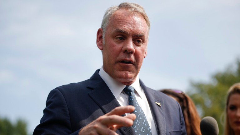 Interior Secretary Ryan Zinke speaks to members of the media outside the White House.
