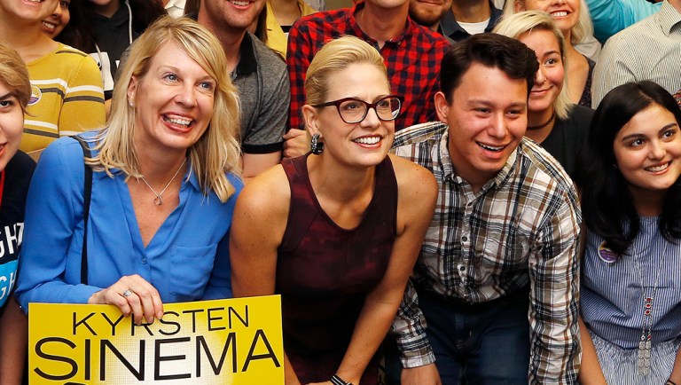 Democratic Rep. Kyrsten Sinema talks to campaign volunteers.