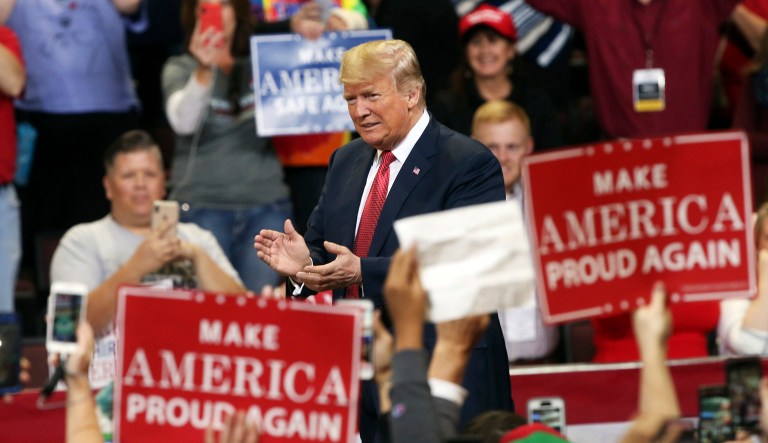 President Trump arrives to speak at a campaign rally, Thursday, Oct. 4, 2018, in Rochester, Minn.