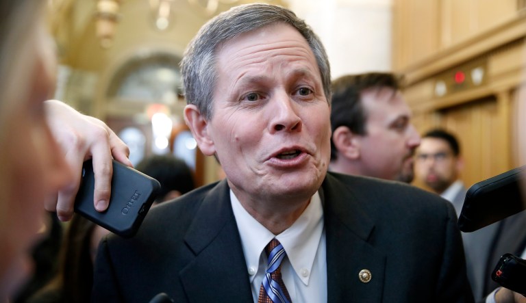 Sen. Steve Daines, R-Mont., smiles as he talks with reporters after a vote to advance Brett Kavanaugh's nomination to the Supreme Court, on Capitol Hill, Friday, Oct. 5, 2018 in Washington.