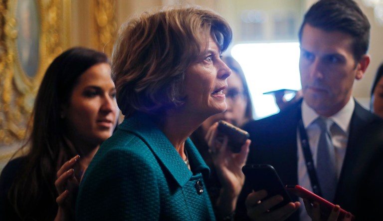 Sen. Lisa Murkowski, R-Alaska, speaks to members of the media after a vote to advance Brett Kavanaugh's nomination to the Supreme Court on Capitol Hill, Friday, Oct. 4, 2018.