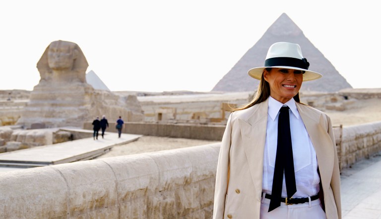 First lady Melania Trump visits the ancient statue of Sphinx, with the body of a lion and a human head, at the historic site of Giza Pyramids in Giza, near Cairo, Egypt, on Saturday.