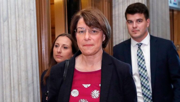 Sen. Amy Klobuchar, D-Minn., heads to the Senate floor.
