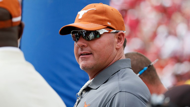 Former Texas Longhorns baseball pitcher Roger Clemens stands on the sideline of an NCAA college football game between the Texas Longhorns and Oklahoma Sooners, Saturday, Oct. 6, 2018, in Dallas, Texas. (AP Photo/Roger Steinman)